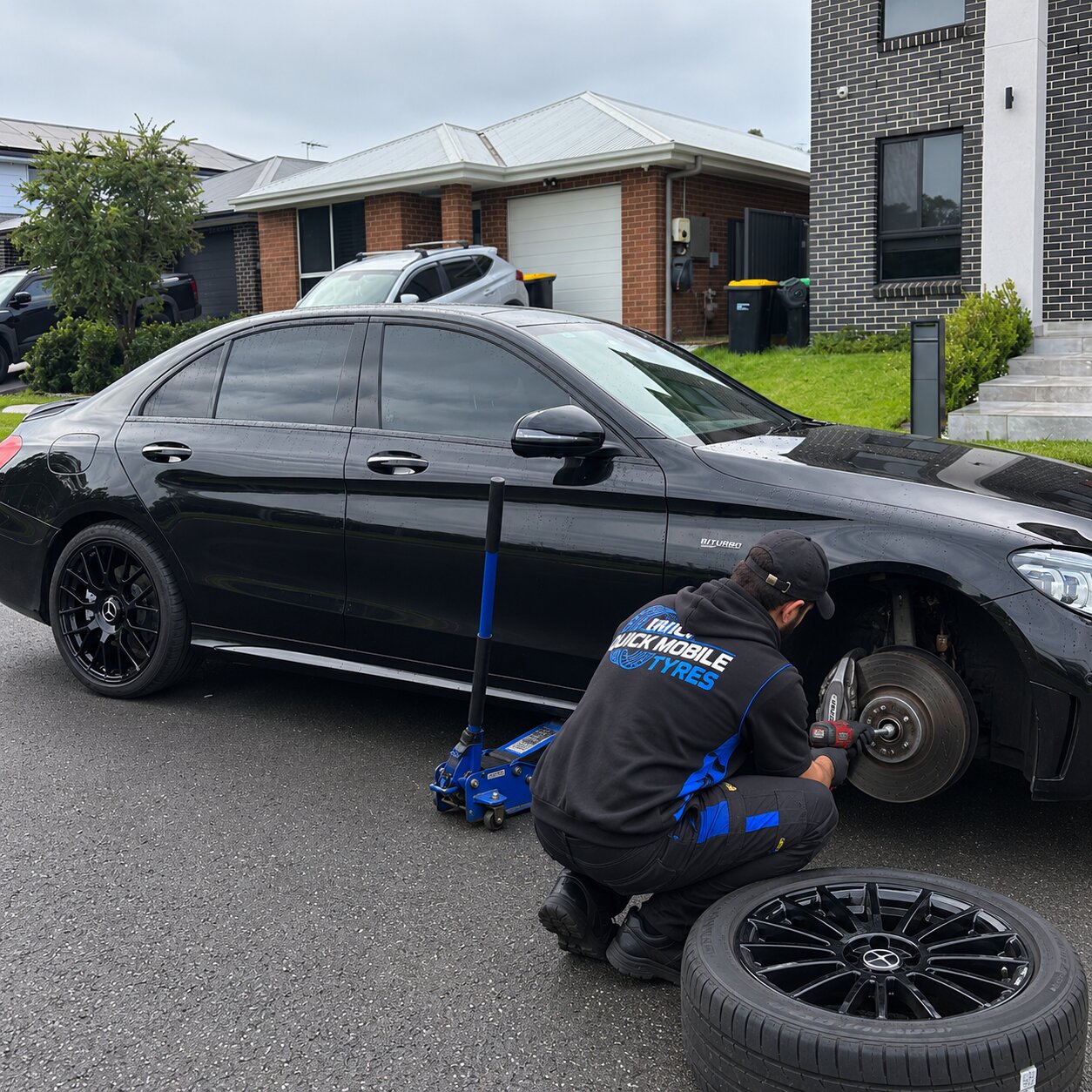Quick Mobile Tyres technician fitting a tyre on-site in Sydney